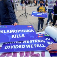 Attendees return signs after a rally to highlight Islamophobia, sponsored by the Muslim Association of Canada including the June 6 London, Ontario attack which killed a Muslim family in what police describe as a hate-motivated crime, in Toronto, Ontario, Canada, June 18, 2021. (Reuters Photo)