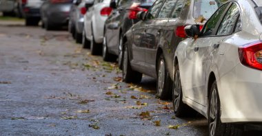 Cars parked along a street. (Shutterstock Photo)
