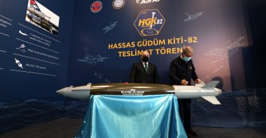 National Defense Minister Hulusi Akar (R) and Industry and Technology Minister Mustafa Varank (L) sign the HGK-82 during a ceremony held in Ankara, Turkey, June 24, 2021. (AA Photo)