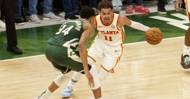 Atlanta Hawks guard Trae Young (R) drives for the basket against Milwaukee Bucks forward Giannis Antetokounmpo during Game 1 of the Eastern Conference Finals for the 2021 NBA Playoffs at Fiserv Forum, Milwaukee, Wisconsin, U.S., June 23, 2021. (Reuters Photo)