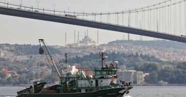 A fishing vessel sails under Bosphorus Bridge along the Bosphorus Strait, Istanbul, Turkey, Oct. 6, 2020. (Shutterstock Photo) 