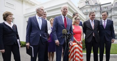 U.S. President Joe Biden, with a bipartisan group of senators, speaks outside the White House in Washington, D.C., U.S., June 24, 2021. (AP Photo)