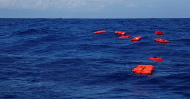 Life jackets float on the water during a training exercise by the German NGO Sea-Eye migrant rescue ship 'Alan Kurdi' while on its way to the search and rescue zone off the North African coast, in the western Mediterranean Sea, August 29, 2019. (Reuters File Photo)