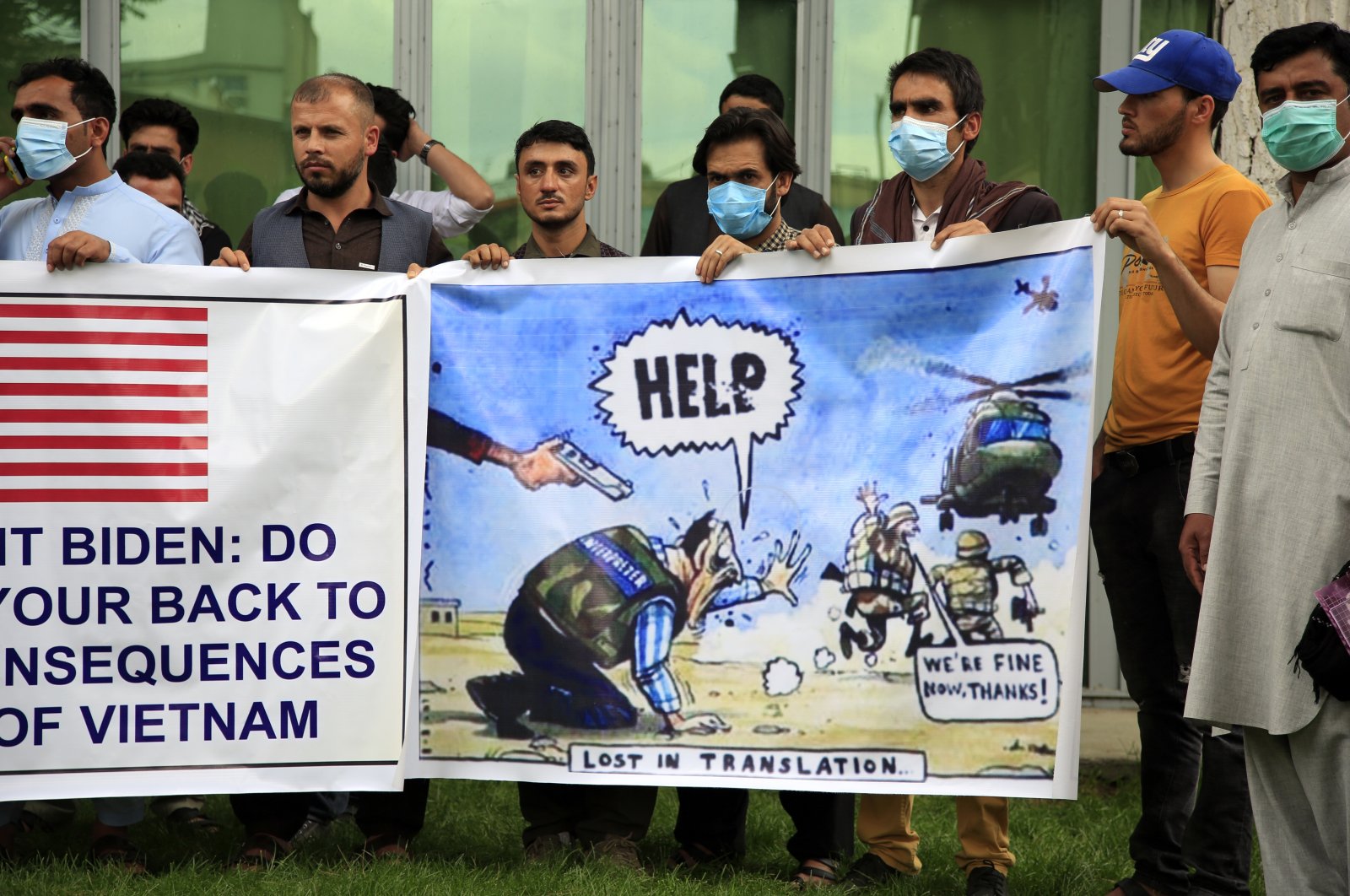 Afghan interpreters hold banners during a protest aimed at the U.S. government and NATO in Kabul, Afghanistan, April 30, 2021. (AP Photo)
