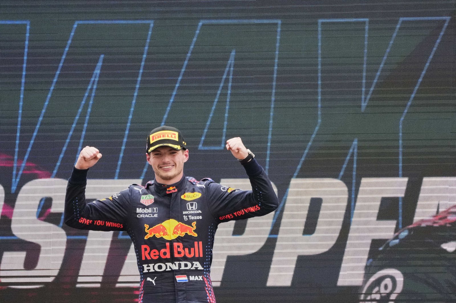 Red Bull driver Max Verstappen of the Netherlands celebrates from the podium after winning during the French Formula One Grand Prix at the Paul Ricard racetrack in Le Castellet, southern France, Sunday, June 20, 2021. (AP Photo/Francois Mori)
