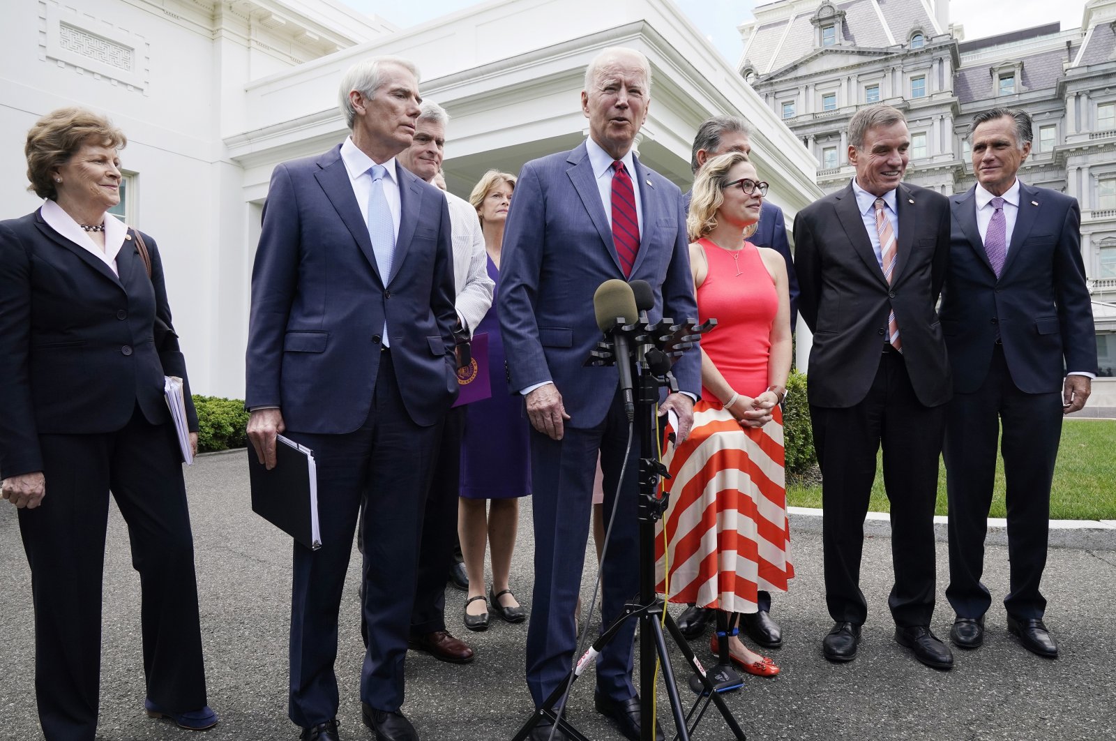 U.S. President Joe Biden, with a bipartisan group of senators, speaks outside the White House in Washington, D.C., U.S., June 24, 2021. (AP Photo)