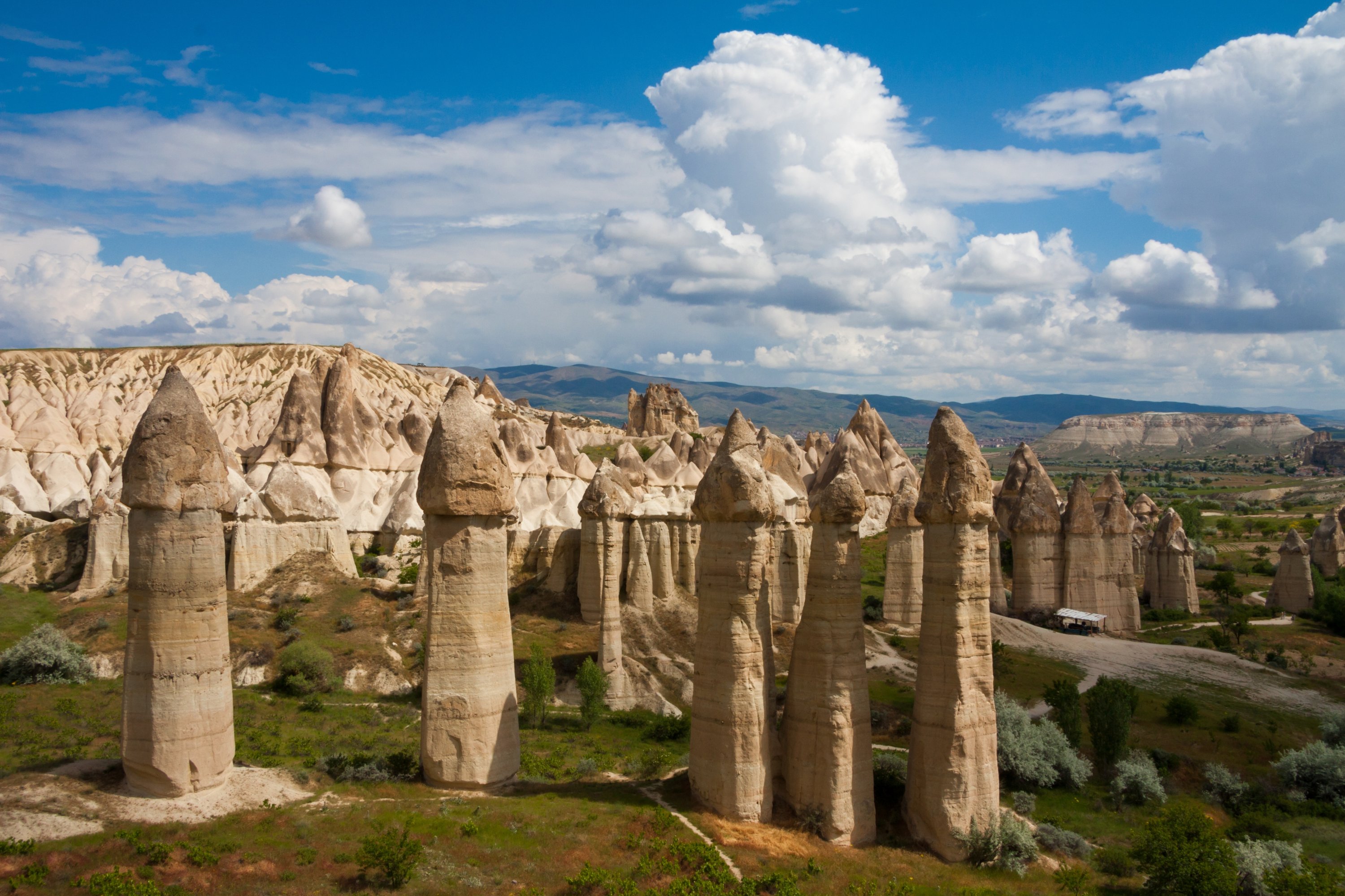The famous fairy chimneys of Cappadocia stand tall in the sunlight in the Göreme village at a location known as the "Love Valley," Nevşehir, Turkey. (Shutterstock Photo)