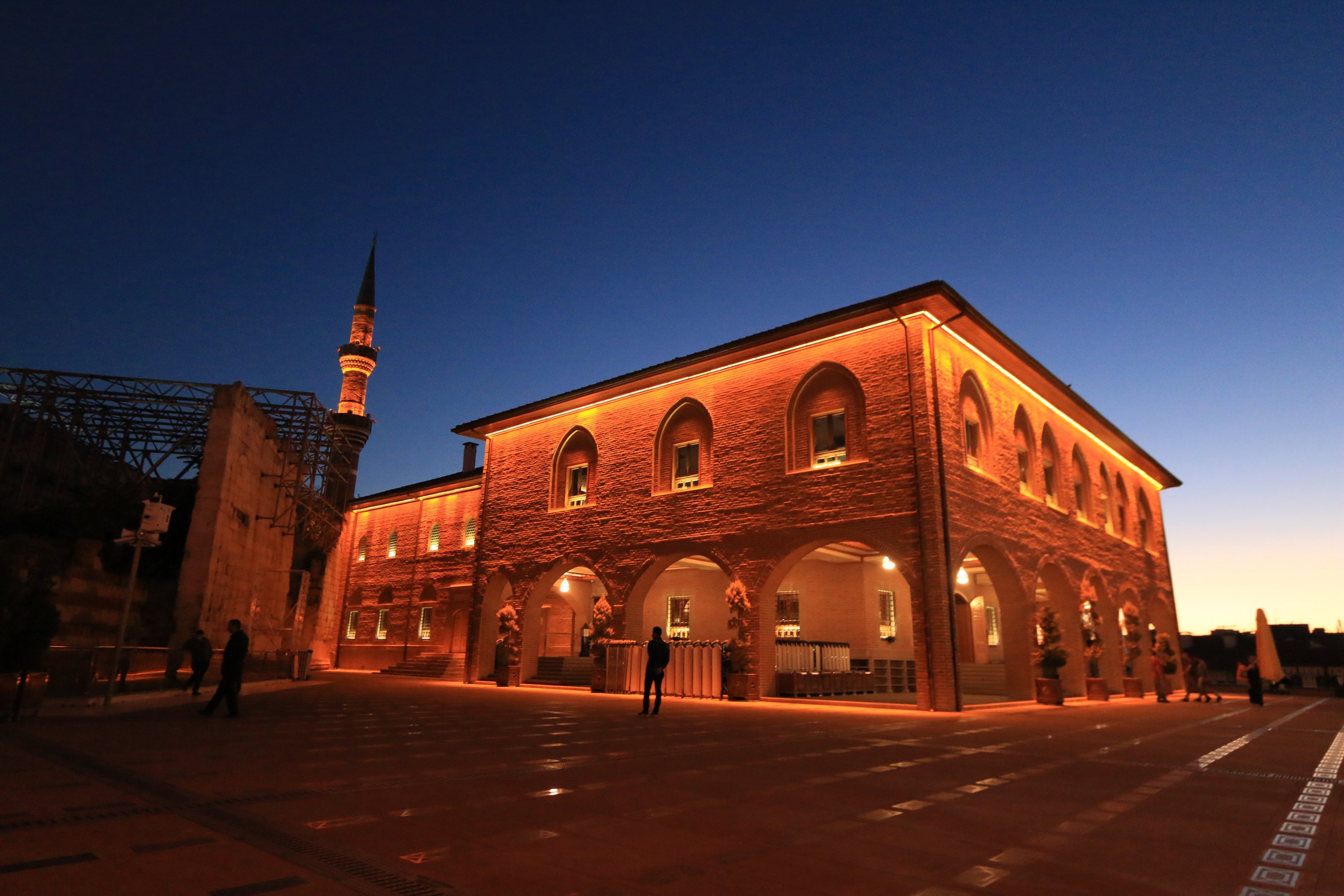 Hacı Bayram Veli Mosque is lit with red lights as night nears in, Ankara, Turkey. (Shutterstock Photo)