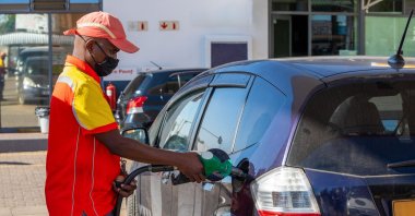African petrol attendant at a gas station in Botswana. (Shutterstock Photo)
