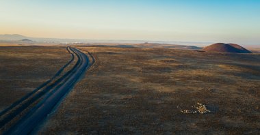 An aerial view shows a long road near Lake Meke, a volcanic crater lake in the Karapınar district of Konya, Turkey. (Shutterstock Photo)