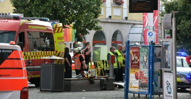 Officials gather at Barbarossaplatz in the German town of Wuerzburg, Germany, June 25, 2021, during a "major operation" in which police arrested a suspect after local media had earlier reported multiple stabbings. (Reuters Photo)