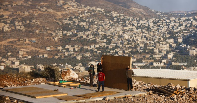 Jewish settlers construct a structure in a new Israeli settler outpost near the Palestinian village of Beita, in Givat Eviatar, Israeli-occupied West Bank, Palestine, June 23, 2021. (Reuters Photo)