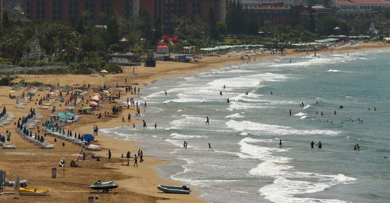 Tourists are seen at a beach in Antalya, southern Turkey, June 20, 2021. (AP Photo)