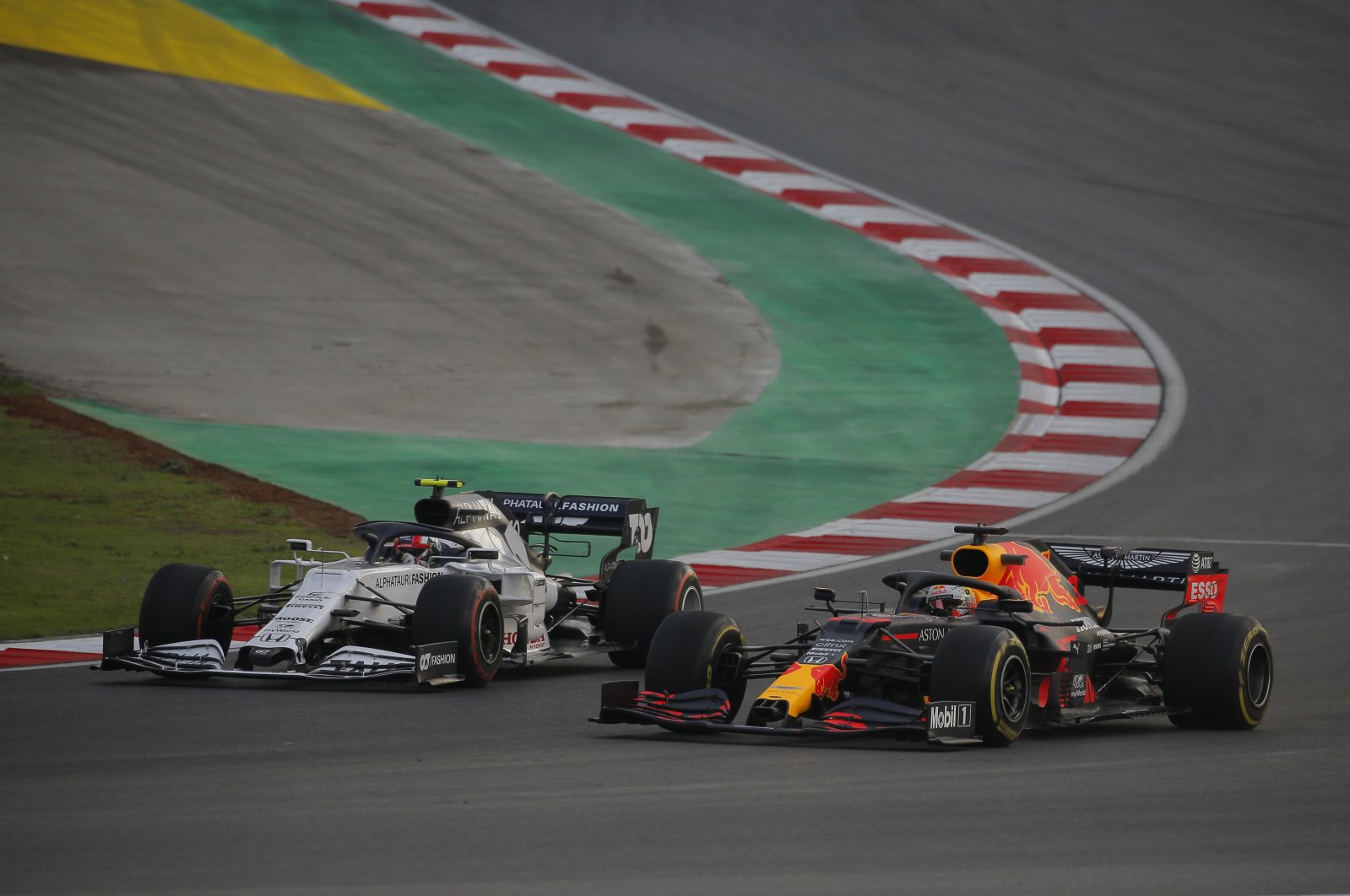 Red Bull's Dutch driver Max Verstappen (R) and AlphaTauri's French driver Pierre Gasly in action during the third practice session at the Istanbul Park circuit racetrack in Istanbul, Nov. 14, 2020. (AP Photo)