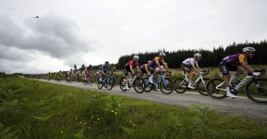The pack rides during the first stage of the Tour de France cycling race over 197.8 kilometers (122.9 miles) with start in Brest and finish in Landerneau, France, June 26, 2021. (AP Photo)