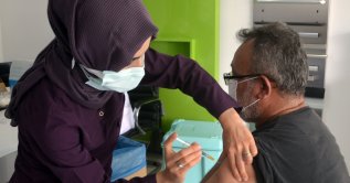 A nurse administers a COVID-19 vaccine jab to a citizen at a hospital in Turkey's northern Amasya province, the province with the second-highest vaccination rate, Amasya, Turkey, June 26, 2021. (AA Photo)
