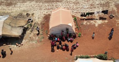 An aerial view shows children attending a class at a camp for internally displaced people in northern Idlib, Syria, June 10, 2021. (Reuters Photo)