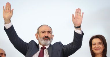 Armenian acting Prime Minister Nikol Pashinian greets his supporters during a rally after winning snap parliamentary elections in Yerevan, Armenia, June 21, 2021. (AP Photo)