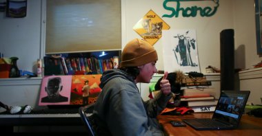 High school senior, Shane Wolf, 18, attends an online class in which Native American students meet regularly with a Lakota elder, Sid Whiting, in Denver, Colorado, U.S., March 19, 2021. (Reuters File Photo)