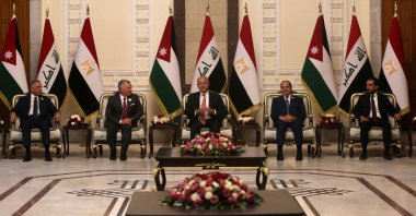 Iraqi President Barham Saleh (C), Prime Minister Mustafa Al-Kadhimi (L) and Parliament Speaker Muhammad Al-Halbousi (R) receive Egypt's President Abdel Fattah el-Sissi (C-R), and Jordan's King Abdullah II (C-L), in the capital Baghdad, Iraq, June 27, 2021. (AFP Photo)