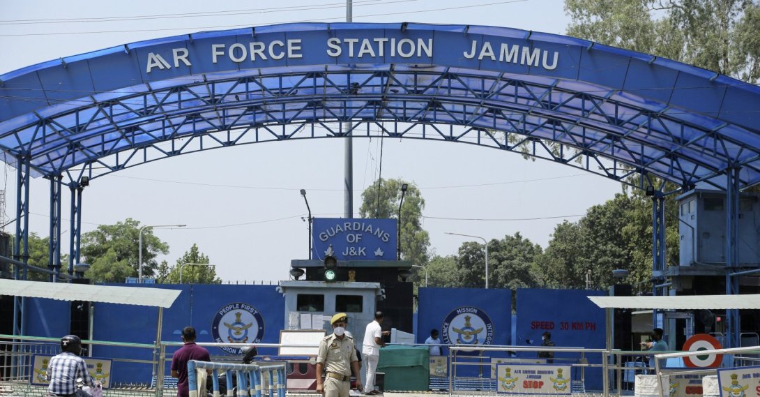 A police officer stands outside the Jammu air force station after two suspected blasts were reported early morning in Jammu, India, June 27, 2021. (AP Photo)