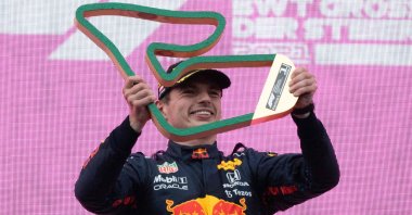 Red Bull's Dutch driver Max Verstappen holds his trophy as he celebrates winning the Formula One Styrian Grand Prix at the Red Bull Ring race track, Spielberg, Austria, June 27, 2021. (AFP Photo)