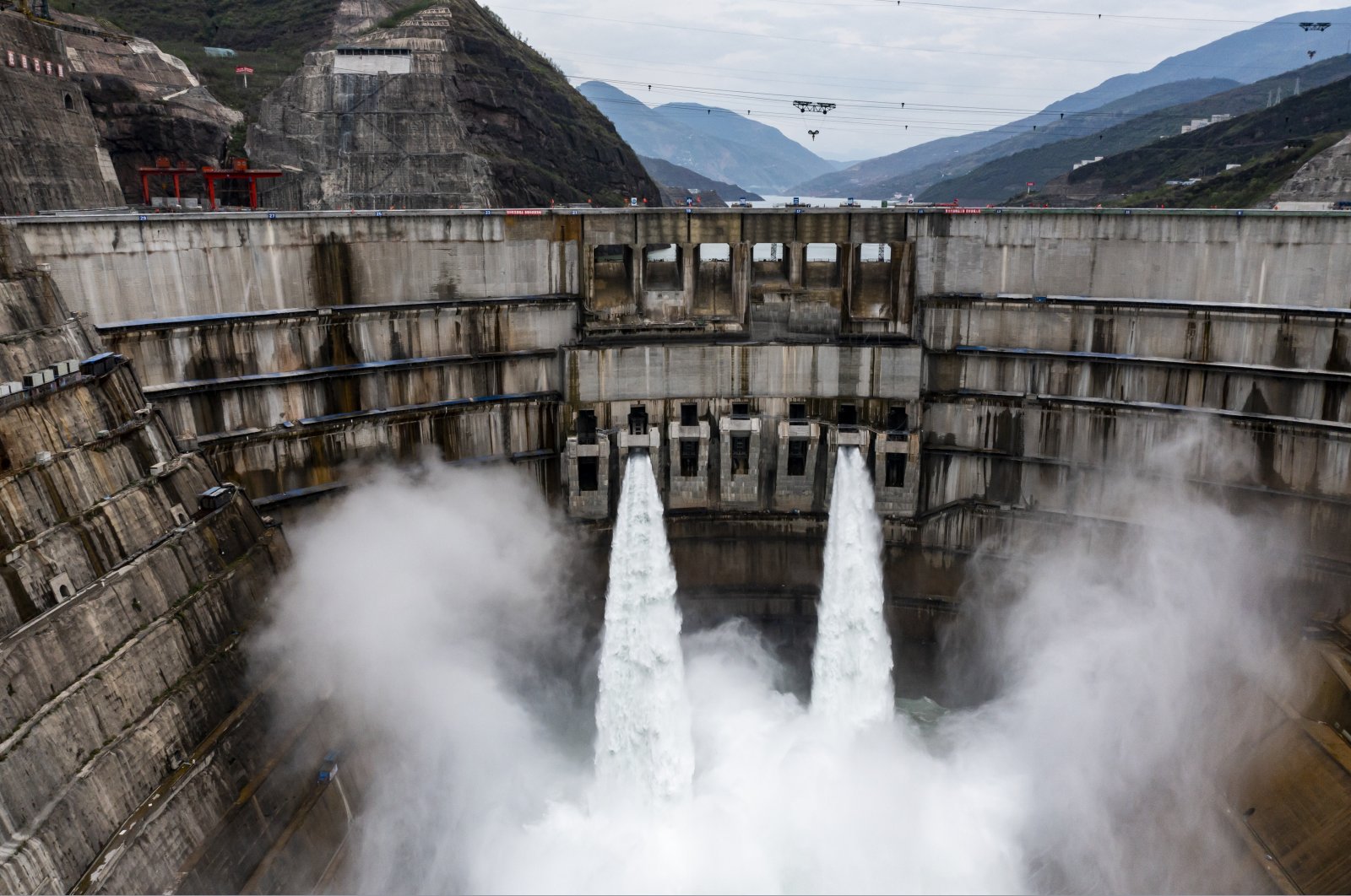 In this photo released by Xinhua News Agency, water is released from the dam of Baihetan hydropower station in Ningnan county, Sichuan province, southwestern China, June 27, 2021. (AP Photo)