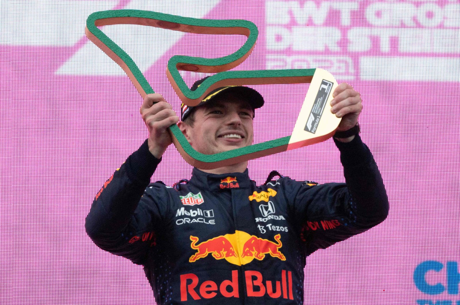 Red Bull's Dutch driver Max Verstappen holds his trophy as he celebrates winning the Formula One Styrian Grand Prix at the Red Bull Ring race track, Spielberg, Austria, June 27, 2021. (AFP Photo)