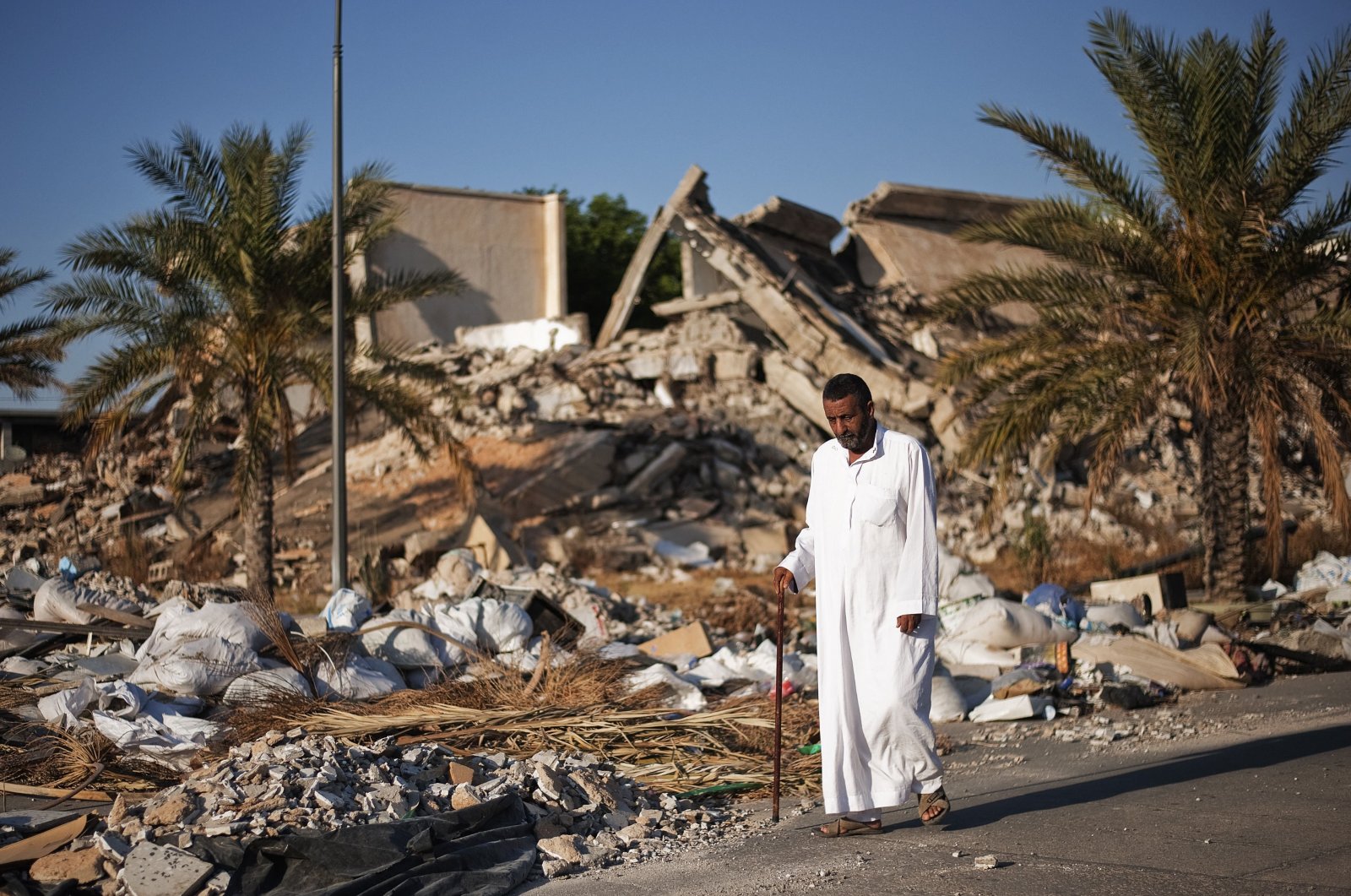 A man walks through the rubble of the destroyed compound of former Libyan leader Moammar Gadhafi, in Tripoli's Bab al-Aziziya area, Libya, June 2, 2012. (AFP File Photo)