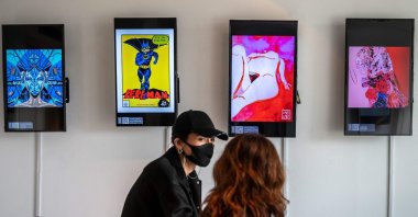 People visit "CrypTOKYO," a physical blockchain art exhibition in Tokyo, Japan, June 25, 2021. (Philip Fong via AFP)