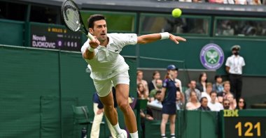 Serbia's Novak Djokovic returns against Britain's Jack Draper during their men's singles first round match at the 2021 Wimbledon at The All England Tennis Club in Wimbledon, southwest London, England, June 28, 2021. (AFP Photo)