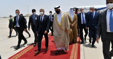 United Arab Emirates Minister of State Ahmed Ali Al Sayegh (R) welcomes Israeli Foreign Minister Yair Lapid (L) at Abu Dhabi Airport, UAE, June 27, 2021. (Shlomi Amsalem/Government Press Office (GPO) via Reuters)