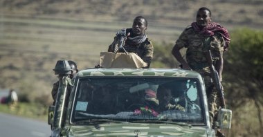 Ethiopian government soldiers ride in the back of a truck on a road near Agula, north of Mekele, in the Tigray region of northern Ethiopia, May 8, 2021. (AP Photo)