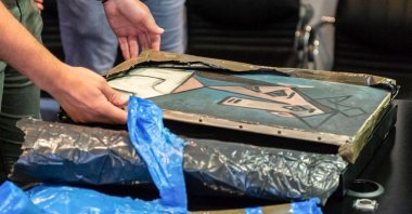 Officials unveil a recovered painting of Pablo Picasso titled "Head of a Woman", in Athens, Greek, June 29, 2021. (Greek Police via AFP)
