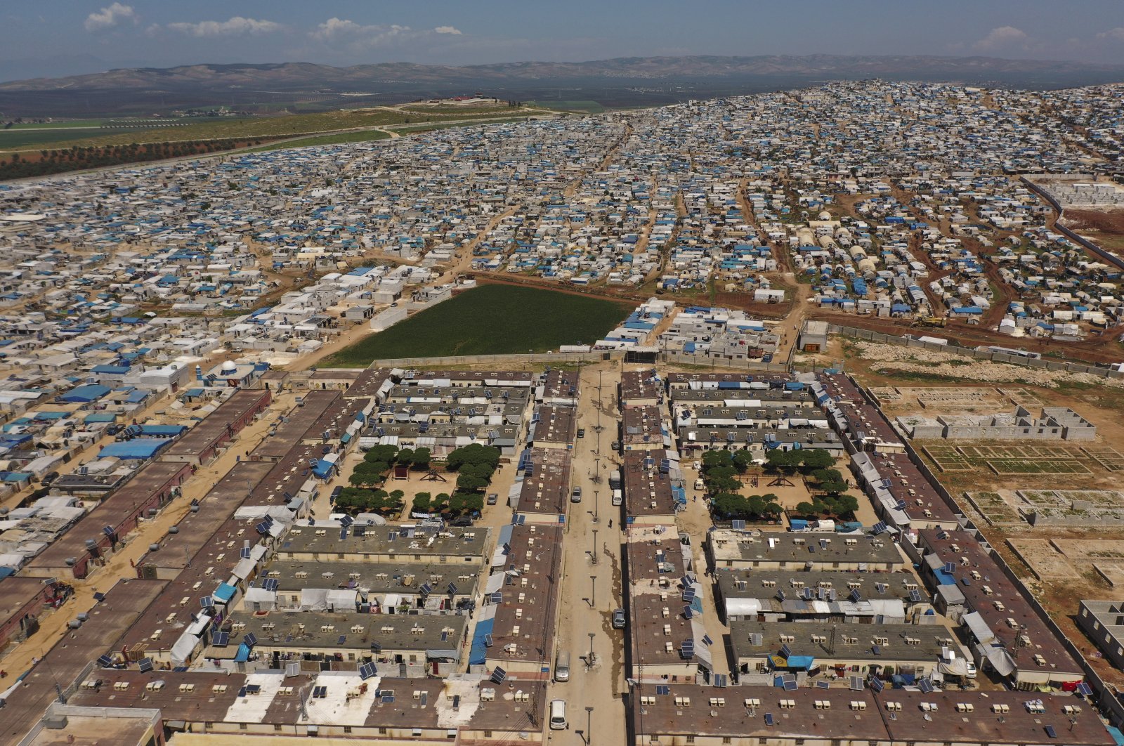 A large refugee camp on the Syrian side of the border with Turkey, near the town of Atma, in Idlib province, Syria. (AP File Photo)