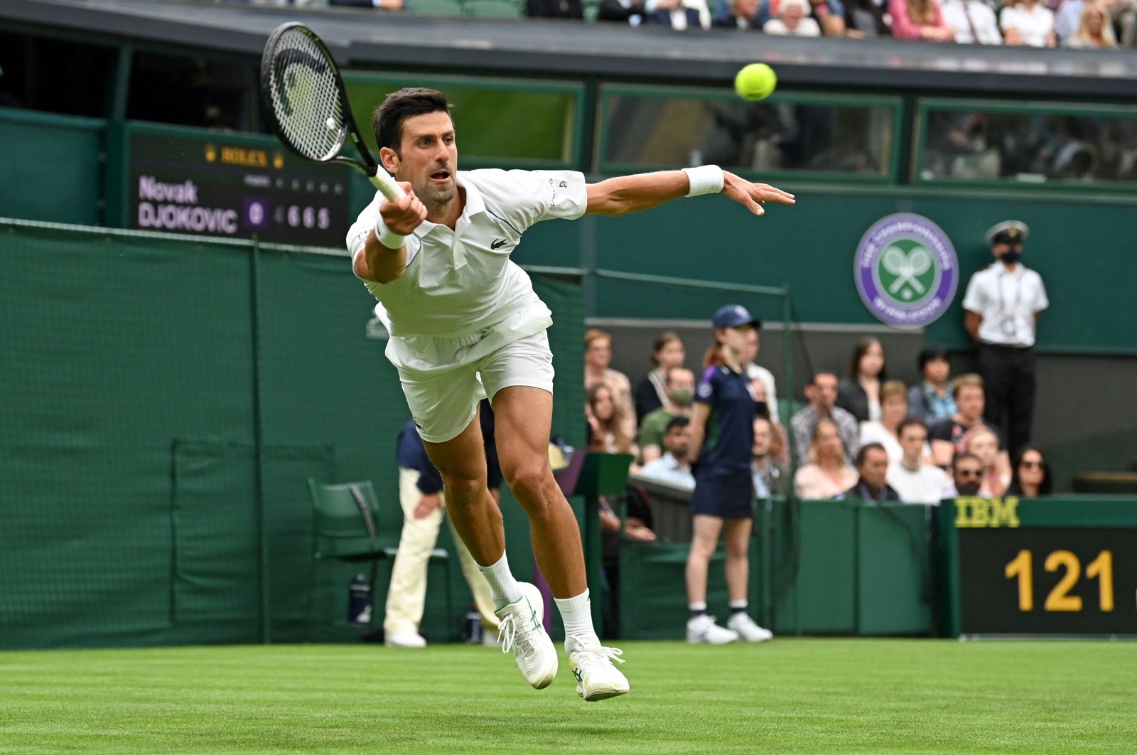 Serbia's Novak Djokovic returns against Britain's Jack Draper during their men's singles first round match at the 2021 Wimbledon at The All England Tennis Club in Wimbledon, southwest London, England, June 28, 2021. (AFP Photo)