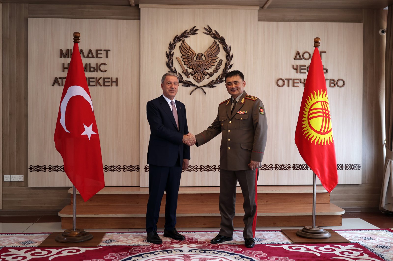 Defense Minister Hulusi Akar (L) and Kyrgyzstan's Defense Minister Taalaybek Omuraliev in Bishkek, Kyrgyzstan, June 29, 2021. (AA Photo)