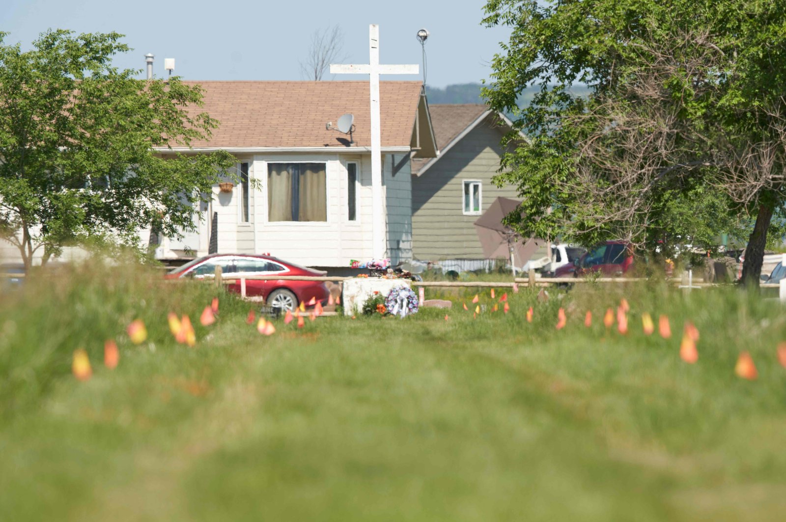 Flags mark the spot where the remains of over 750 children were buried on the site of the former Marieval Indian Residential School in Cowessess First Nation, Saskatchewan, Canada, June 25, 2021. (AFP Photo)