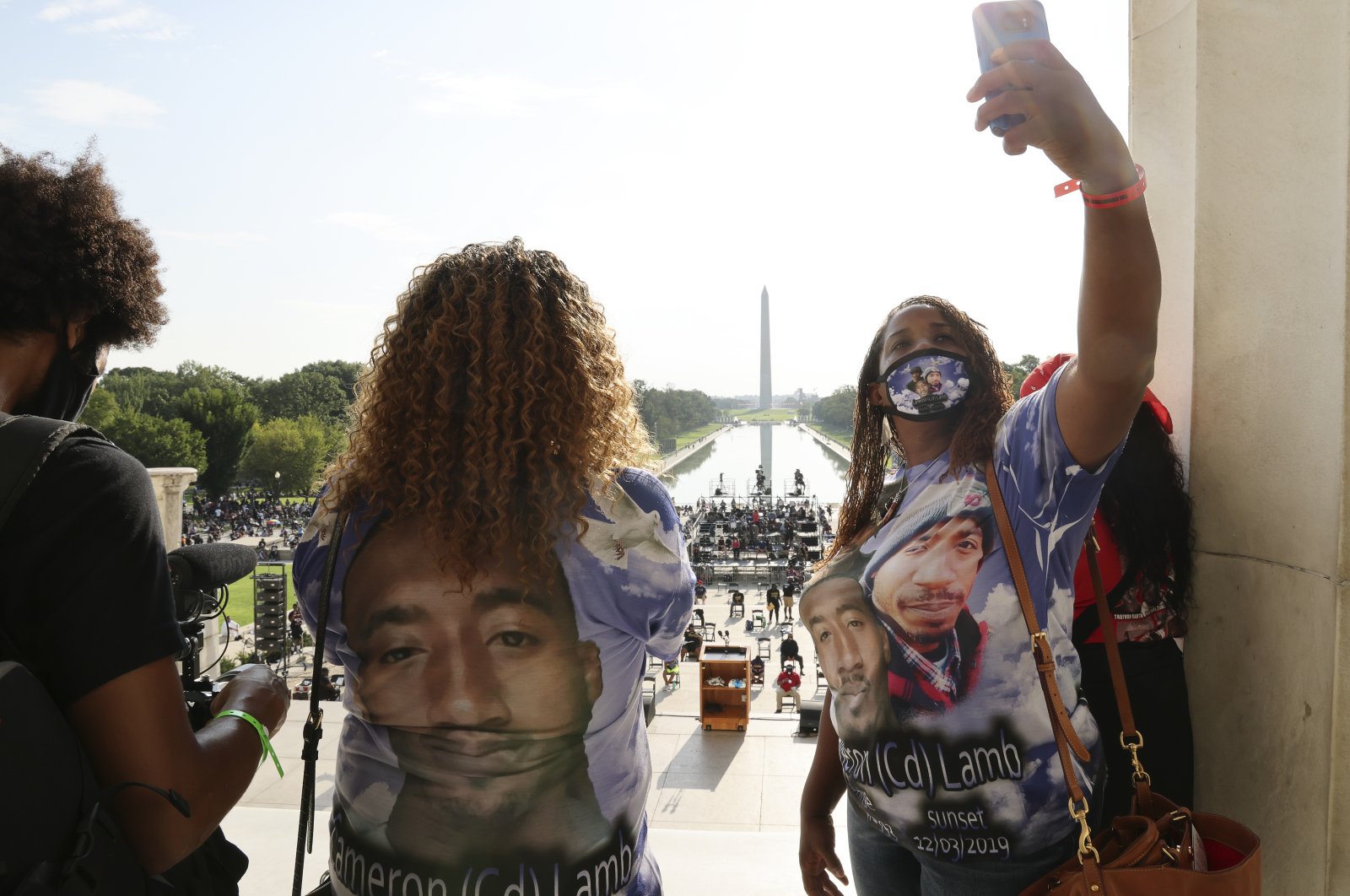 Laurie Bey (R) whose son Cameron Lamb was shot and killed by Kansas City police in 2019, stands with Merlon Ragland, Cameron's aunt, as demonstrators gather at the Lincoln Memorial as final preparations are made for the March on Washington, Washington, D.C., the U.S., Aug. 28, 2020. (AP File Photo)