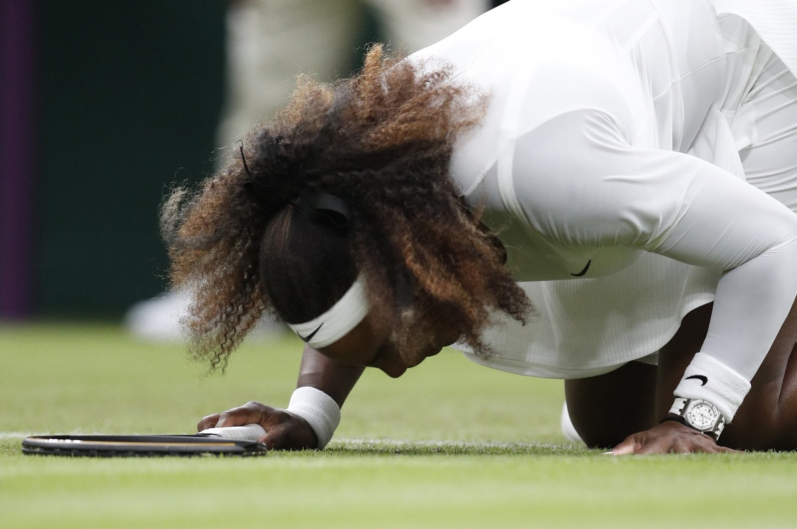 Serena Williams of the U.S. reacts after sustaining an injury during her first round match against  Belarus' Aliaksandra Sasnovich at All England Lawn Tennis and Croquet Club in London, Britain, June 29, 2021 (Reuters Photo)