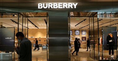 A man walks past a store of luxury brand Burberry at a shopping mall in Beijing, China March 26, 2021. (Reuters Photo) 