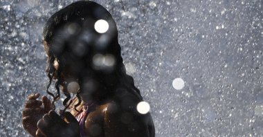 Cora Richardson, 7, cools off in the Rotary Fountain at Riverfront Park, in downtown Spokane, Washington, U.S.  June 29, 2021. (AP Photo)