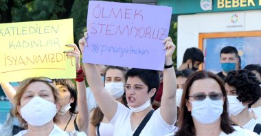 Women carry placards reading "We don't want to die" in a protest over the murder of Pınar Gültekin, who was killed by her former boyfriend, in Kayseri, central Turkey, July 25, 2020. (AA PHOTO)