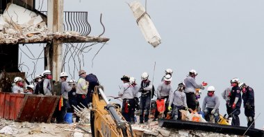 Emergency workers conduct search and rescue efforts at the site of a partially collapsed residential building in Surfside, Florida, U.S., June 30, 2021. (Reuters Photo)