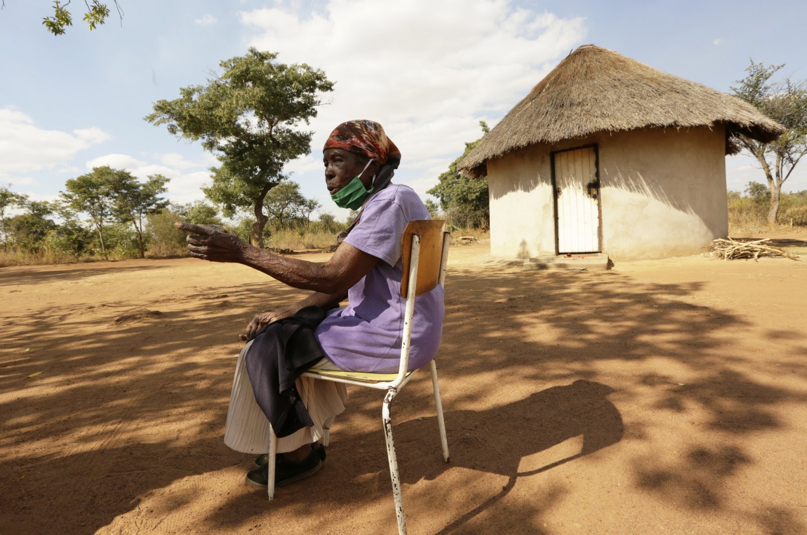 Matrida Tendayi, from Dema communal lands east of the capital Harare, talks at her homestead, Zimbabwe, June, 23, 2021. (AP Photo)