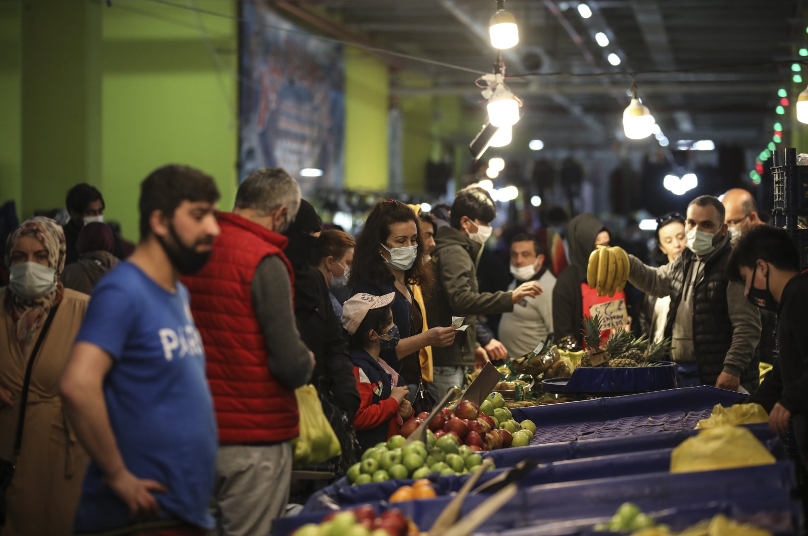 People shop at a local market in Istanbul, Turkey, April 29, 2021. (AP Photo)