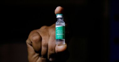 A man displays a vial of AstraZeneca's COVISHIELD vaccine as the country receives its first batch of COVID-19 vaccines under the COVAX scheme, in Accra, Ghana, Feb. 24, 2021. (Reuters Photo)