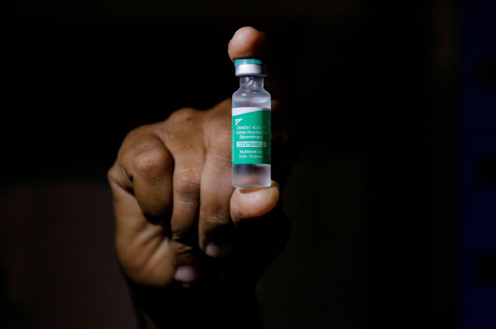 A man displays a vial of AstraZeneca's COVISHIELD vaccine as the country receives its first batch of COVID-19 vaccines under the COVAX scheme, in Accra, Ghana, Feb. 24, 2021. (Reuters Photo)