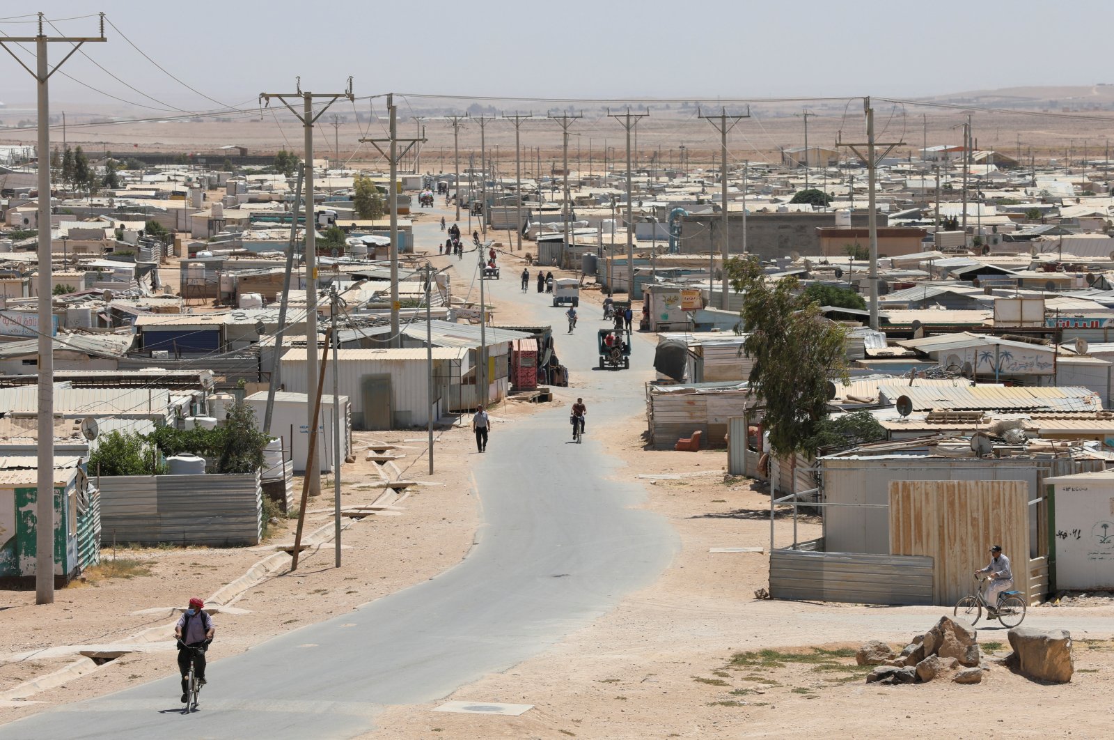 Syrian refugees are seen at the Zaatari refugee camp in the Jordanian city of Mafraq, near the border with Syria, Jordan June 17, 2021.(REUTERS Photo)  