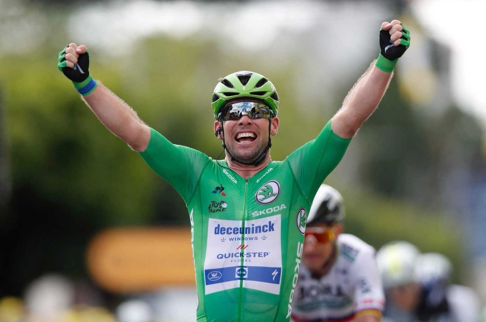Team Deceuninck Quickstep's Mark Cavendish of Great Britain celebrates as he crosses the finish line of the 6th stage of the 108th edition of the Tour de France cycling race, 160 km between Tours and Chateauroux, July 1, 2021. (AFP Photo)